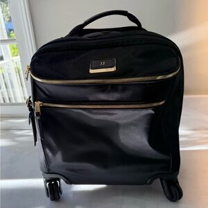 Tumi Black Rolling Travel Bag with Gold Accents
